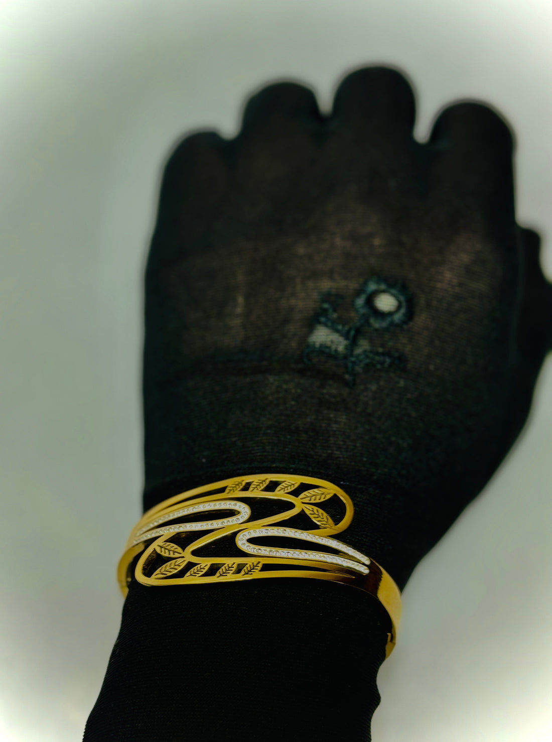 Stone Studded Bracelet with Embraced Leaves